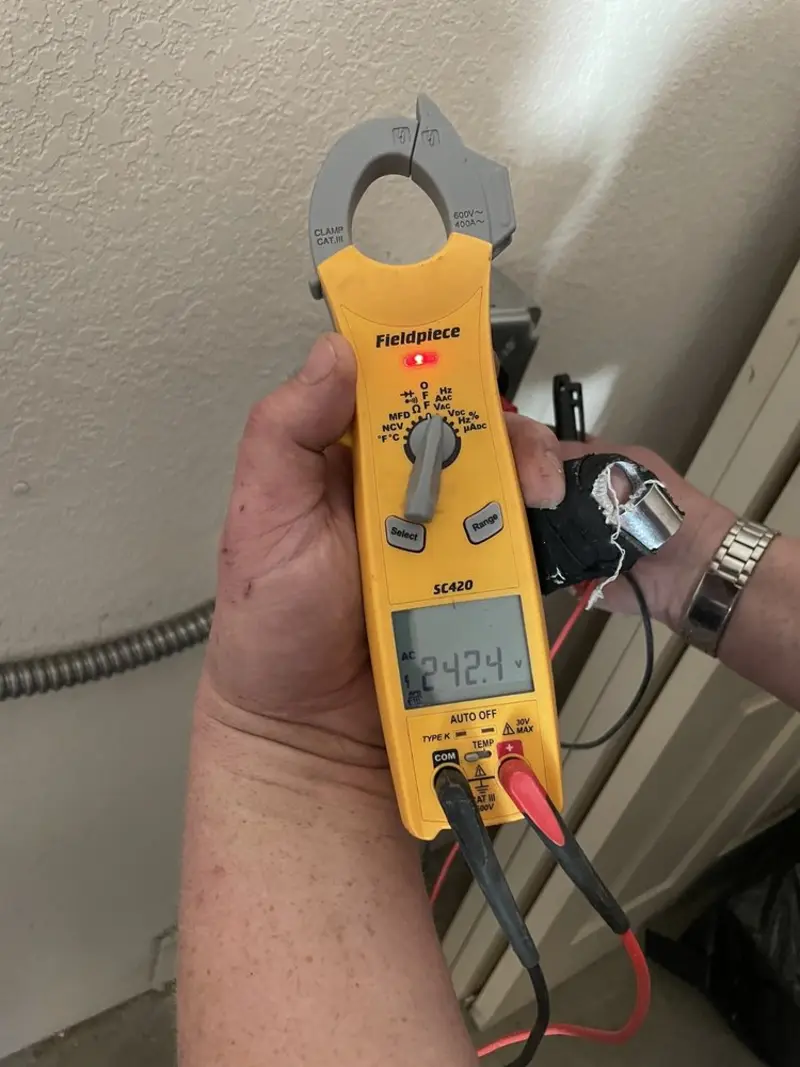 Voltage testing with clamp meter during Outlet Installation in Cordes Lakes